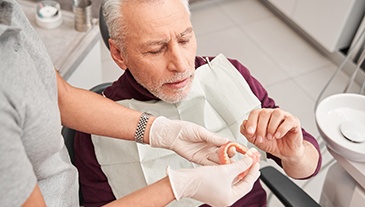 Man with dentures at the dentist