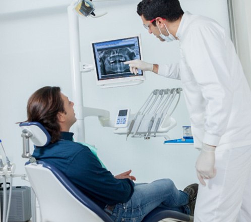 Lakeway dentist showing a seated patient their dental X-rays