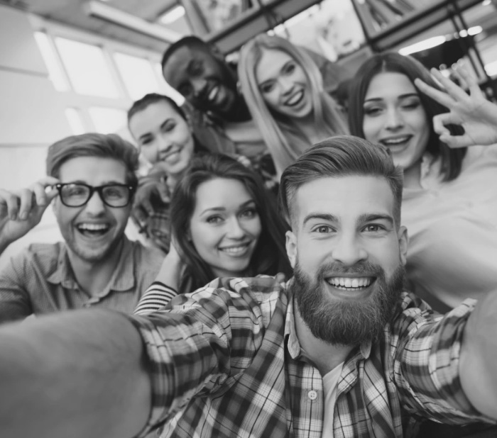 Group of young friends taking selfie together