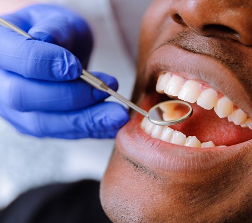 a patient undergoing an oral cancer screening