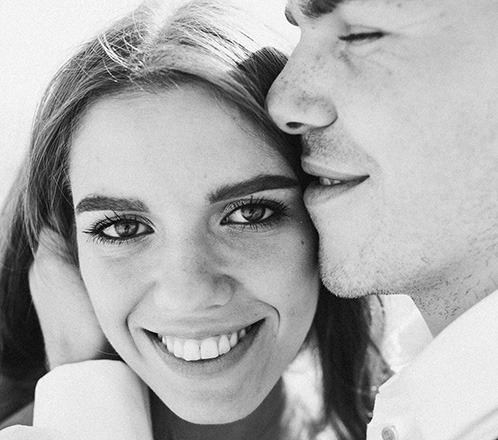 Man and woman smiling after dental treatment with intraoral scanners