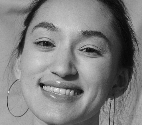 Smiling young woman with tooth colored fillings