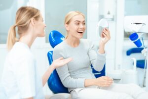 Woman smiling after getting her veneers placed